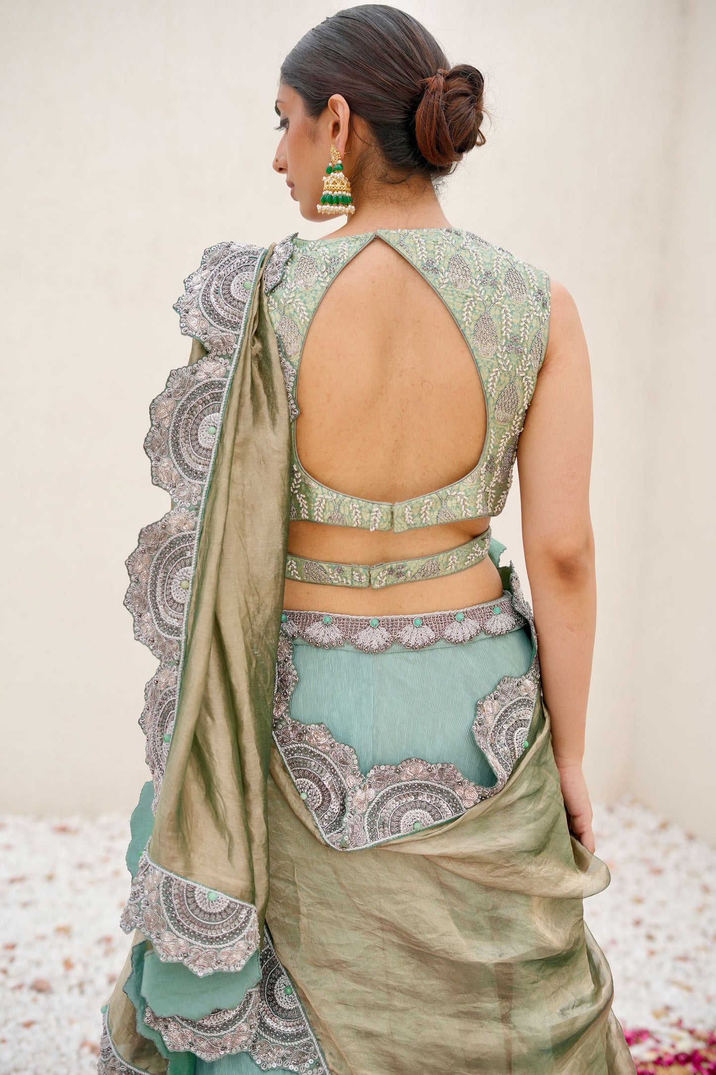 Sea Green Hand-Embroidered Wrinkle Lehenga Paired with Brocade Blouse and Cutwork Border Dupatta