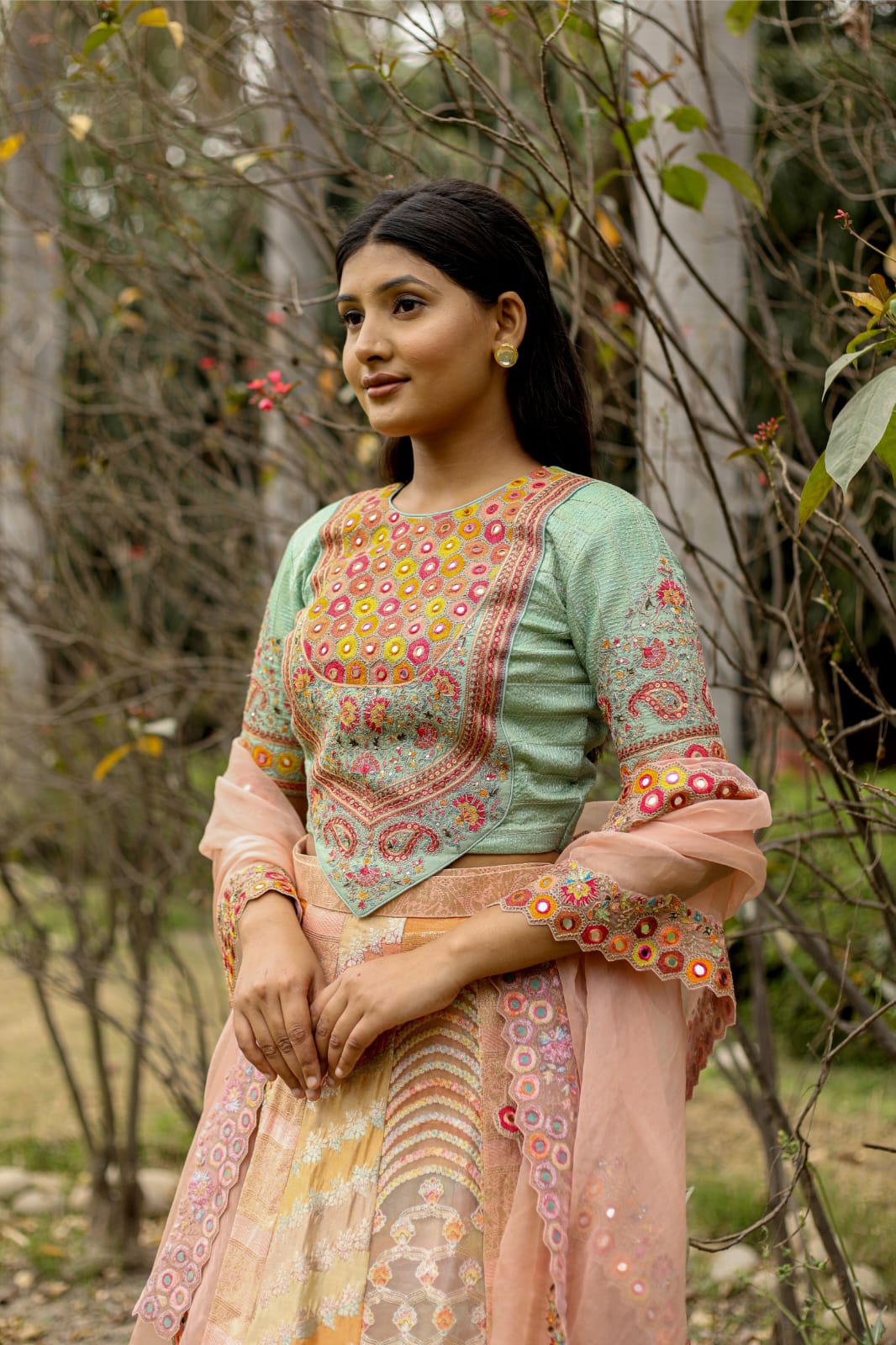Luxury Peach-Mint Green Lehenga Saree Adorned with Mirror and Thread Embroidery