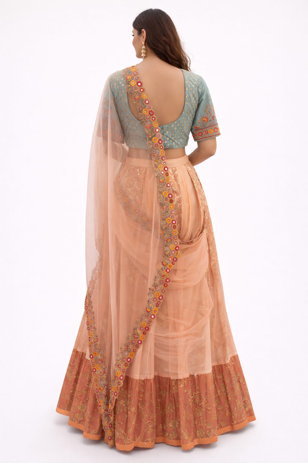 Peach and mint green lehenga saree in organza, silk, and tissue, embellished with thread, mirror, and sequin work.