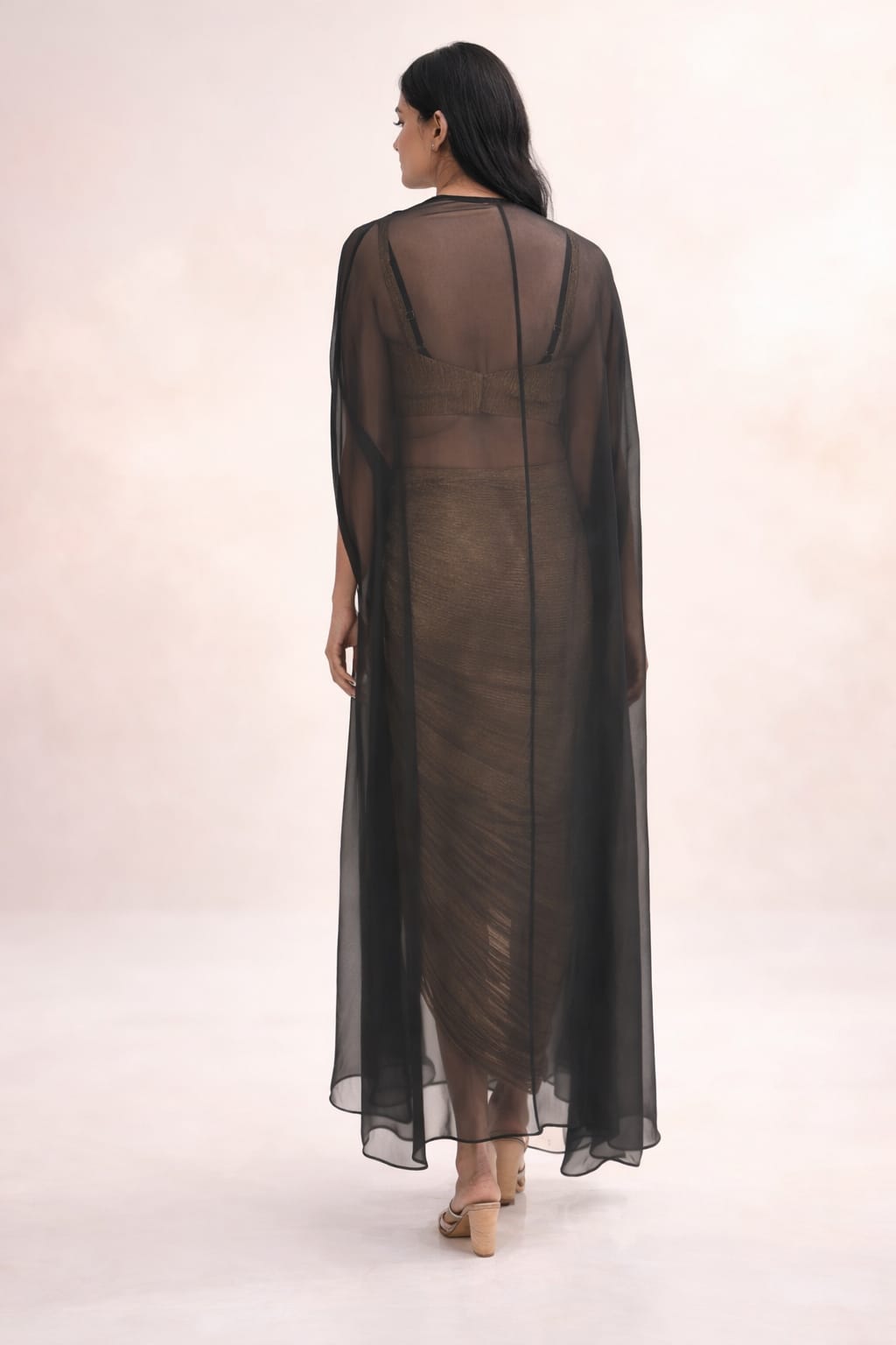 Black cape with crushed tissue skirt & bustier with long hangings on cape