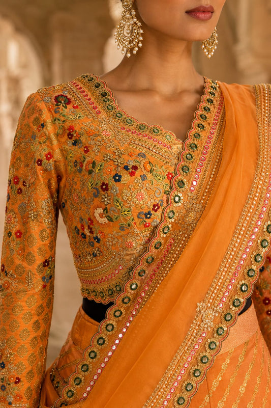 Orange-peach lehenga Saree with a subtle sheen and diagonal woven stripe detailing.