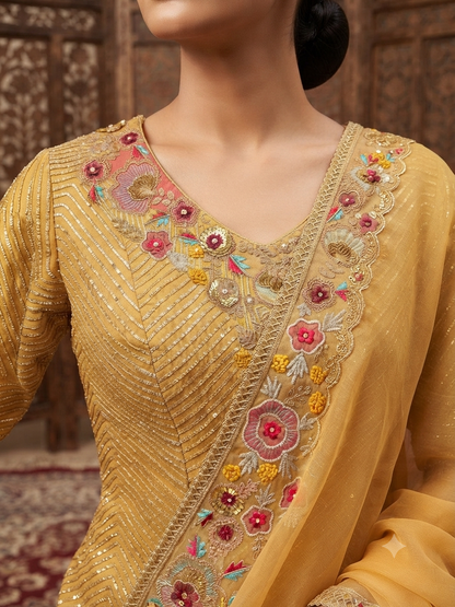 Mustard-gold/yellow lehenga saree with a subtle textured and lustrous finish throughout.