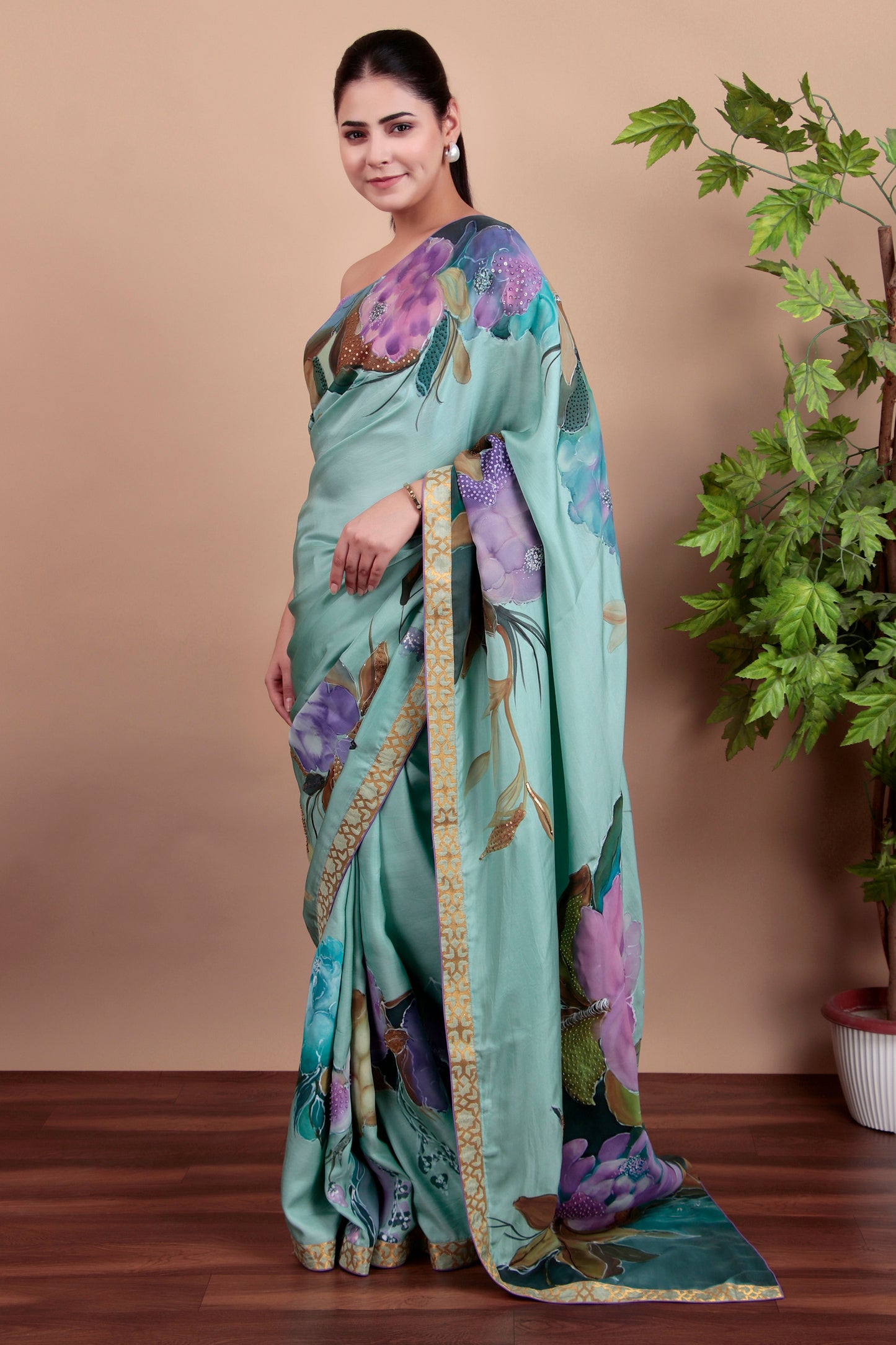 Luxury Sea Green Tulle Saree with Floral Painting and Sparkling Sequin Accents