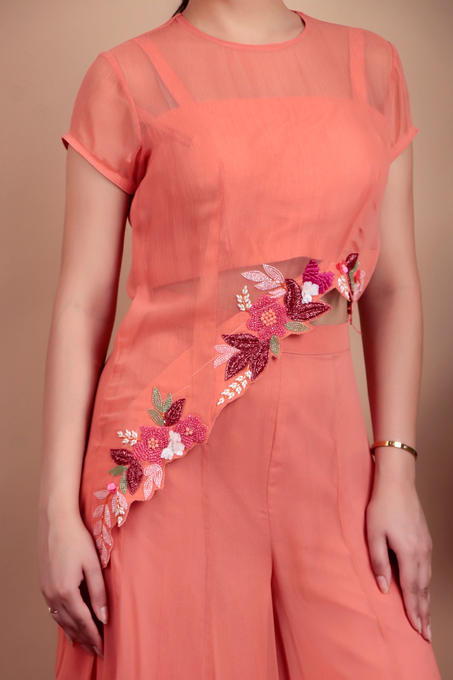 Elegant Coral Indo-Fusion Ensemble Featuring Sheer Top and Flared Palazzo