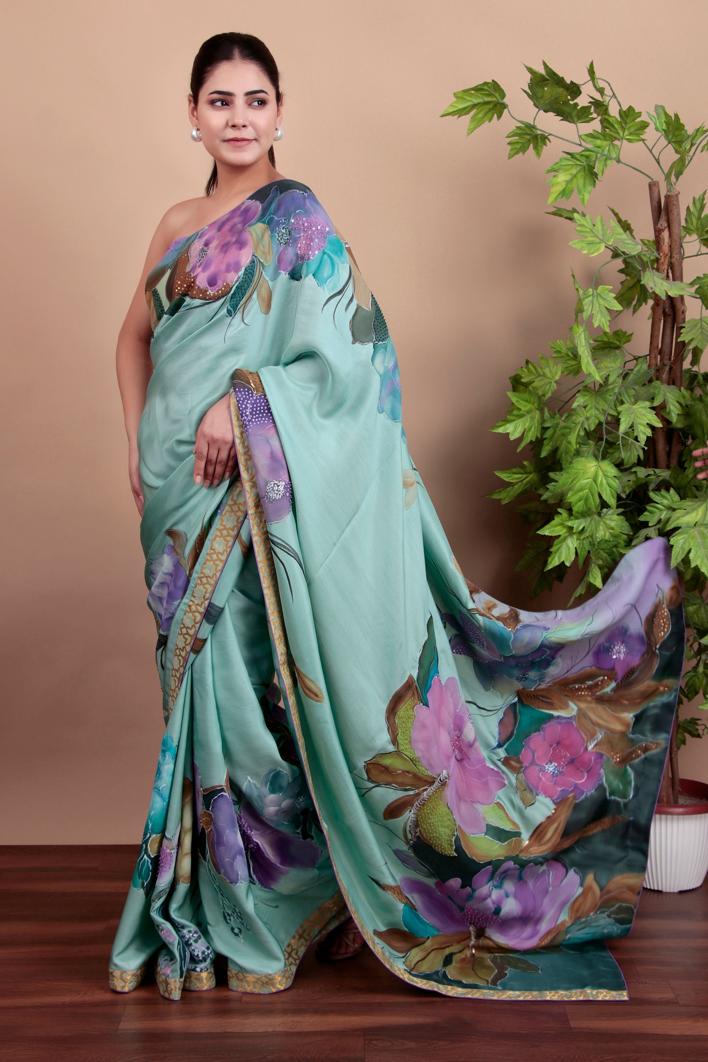 Luxury Sea Green Tulle Saree with Floral Painting and Sparkling Sequin Accents