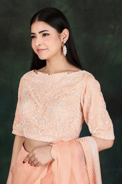 Peach Organza Pallu Lehenga Saree in Silk with Intricate Pearl Handcrafted Blouse