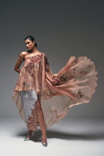 Organza one-shoulder asymmetrical cape paired with a crushed satin pencil skirt