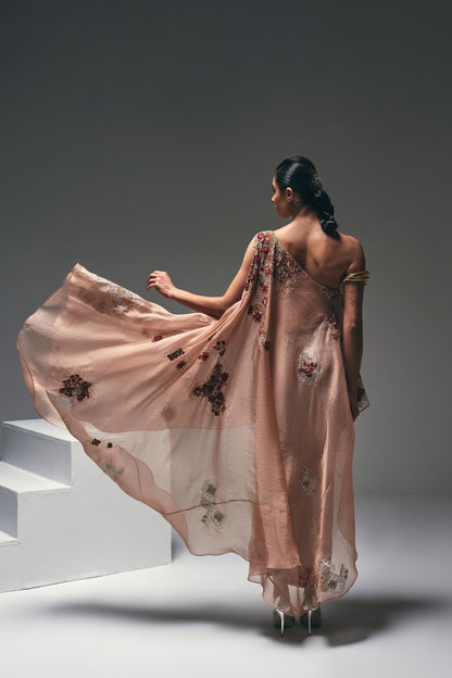Organza one-shoulder asymmetrical cape paired with a crushed satin pencil skirt
