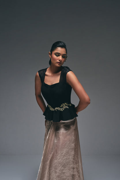 Crepe peplum top paired with a tissue drape skirt,
