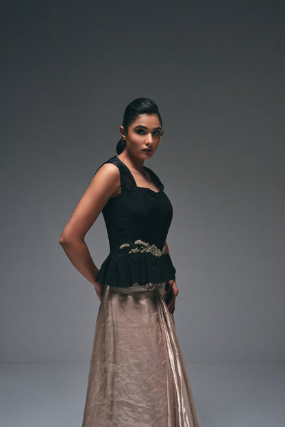 Crepe peplum top paired with a tissue drape skirt,