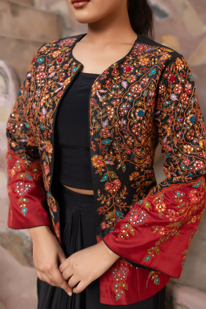 Black embroidered jacket set with bustier and drape skirt.