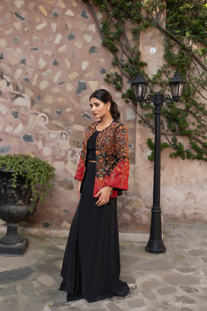 Black embroidered jacket set with bustier and drape skirt.