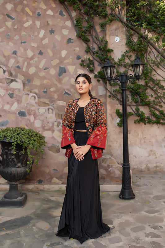 Black embroidered jacket set with bustier and drape skirt.