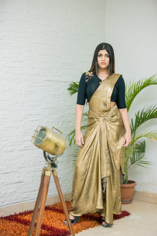 Glamorous Metallic Gold And Black Lycra Saree With Cutdana Embellishments