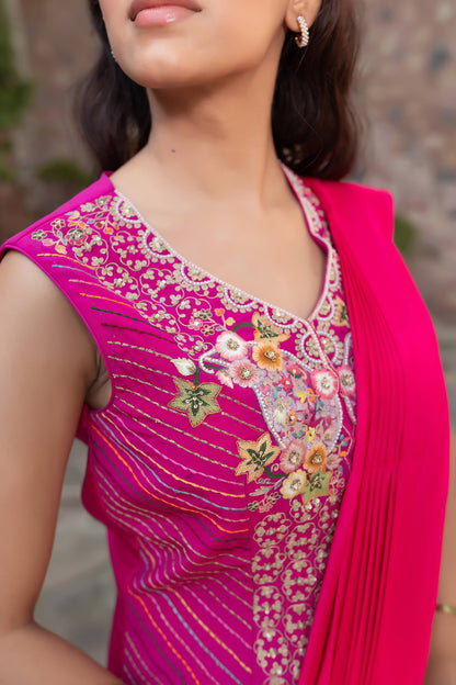 Magenta Draped Saree With Intricate Embroidered Sleeveless Blouse