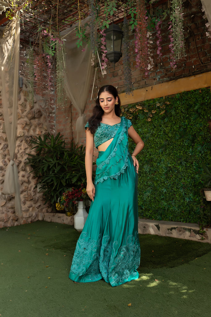 peacock green drape saree with heavy blouse & attached pallu.