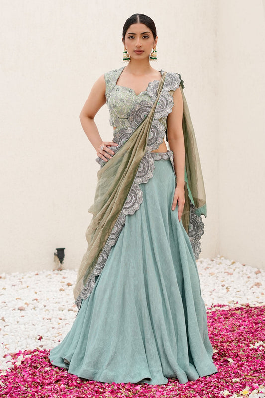 Sea Green Hand-Embroidered Wrinkle Lehenga Paired with Brocade Blouse and Cutwork Border Dupatta