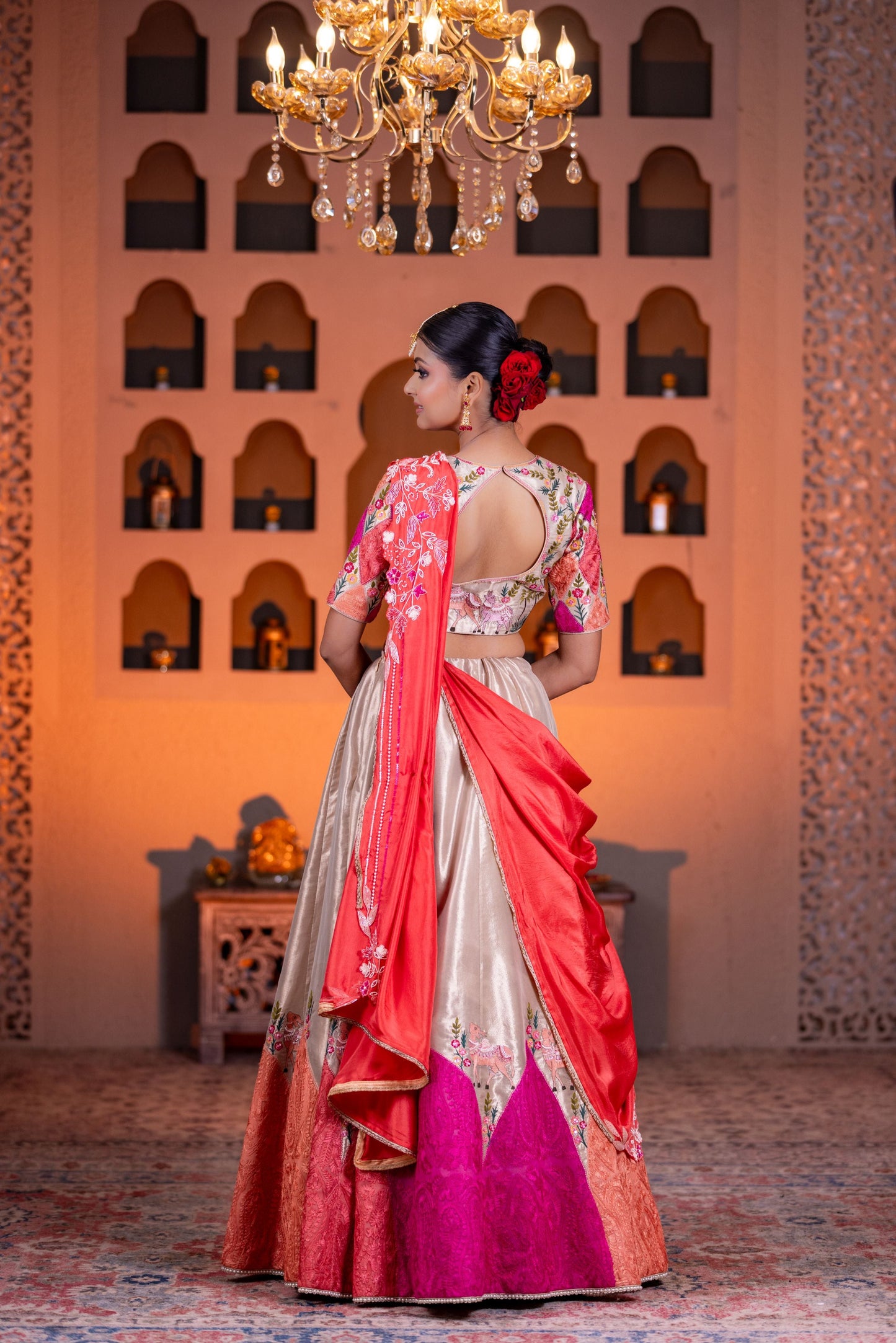 Festive Golden Tissue Cow Work Lehenga with Contrast Dupatta and Vibrant Pink Accents
