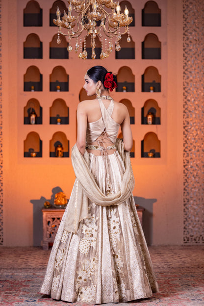Bridal Style Golden Tissue Lehenga with Intricate Hand Embellishments and Halter Neck Brocade Blouse