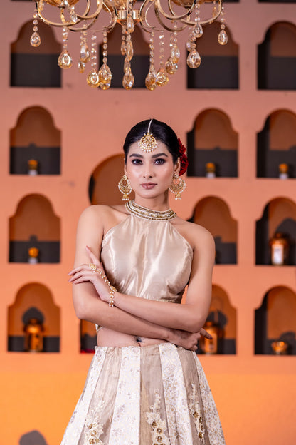 Bridal Style Golden Tissue Lehenga with Intricate Hand Embellishments and Halter Neck Brocade Blouse