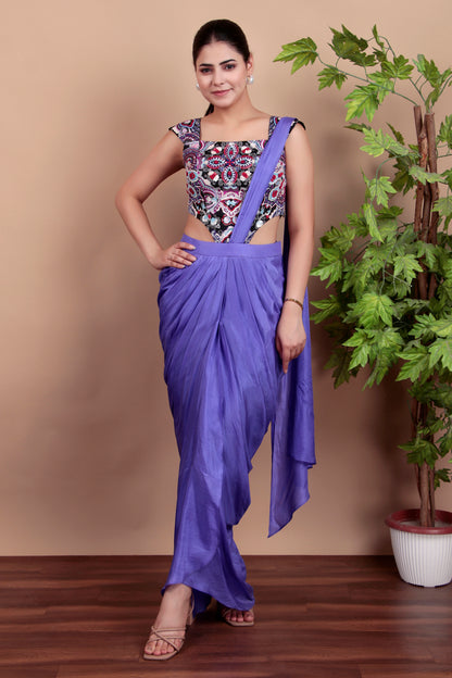 This stylish draped saree is paired with a printed  blouse
