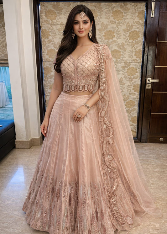 baby pink lehenga set in Jimmy Choo and organza, richly adorned with moti, sequins, cutdana, zari, and dori work.