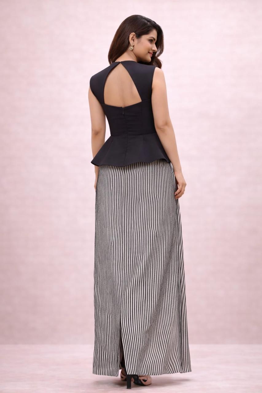 Black peplum top with black sequence skirt