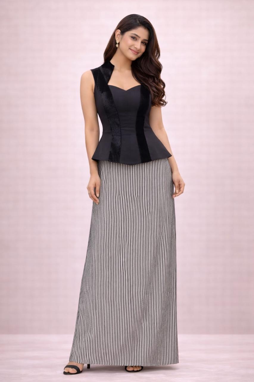 Black peplum top with black sequence skirt