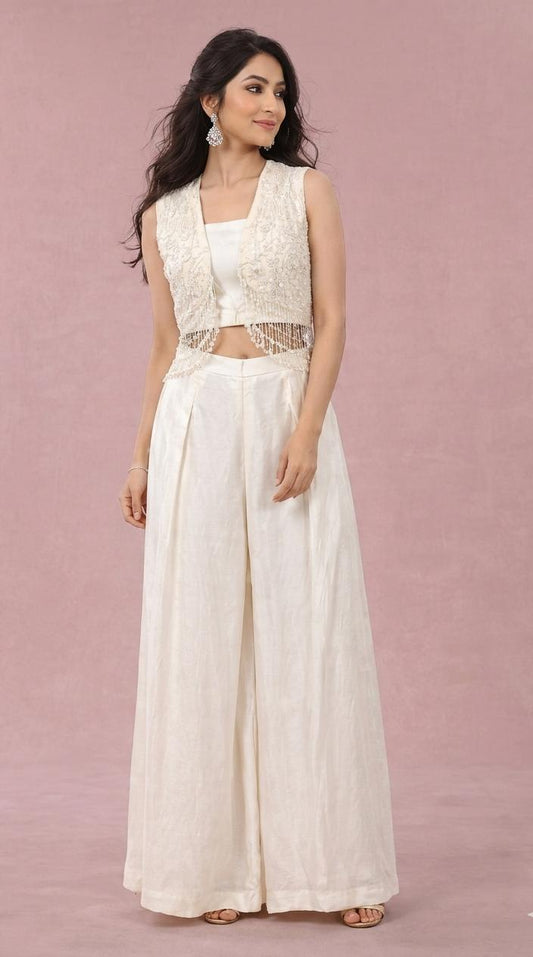 Off white short jacket with long pearl hangings & loose pallazo pants
