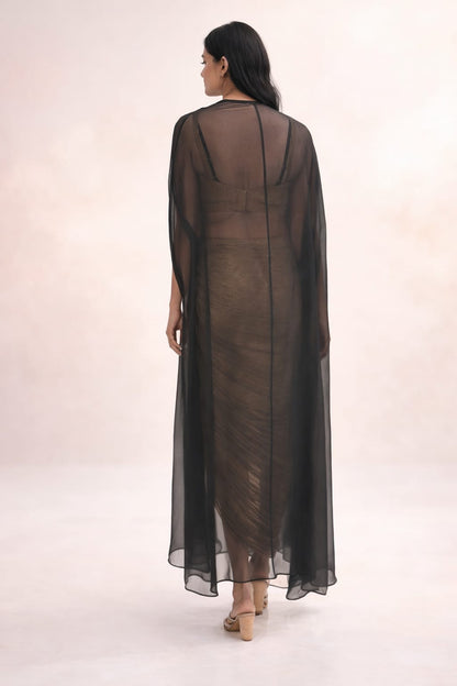 Black cape with crushed tissue skirt & bustier with long hangings on cape