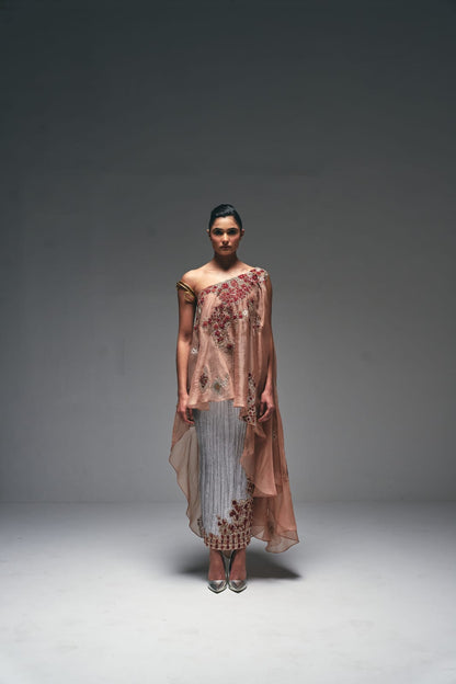 Organza one-shoulder asymmetrical cape paired with a crushed satin pencil skirt