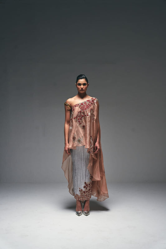 Organza one-shoulder asymmetrical cape paired with a crushed satin pencil skirt
