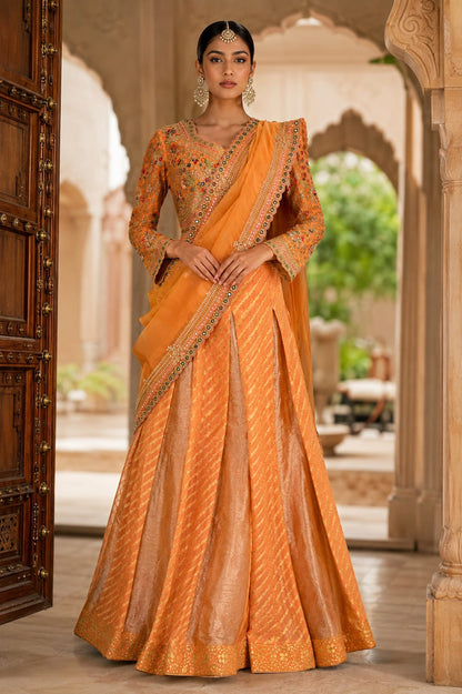 Orange-peach lehenga Saree with a subtle sheen and diagonal woven stripe detailing.