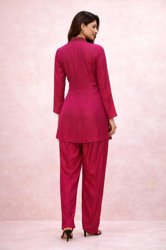 Hot pink cordset with hand work on neckline  of crystals