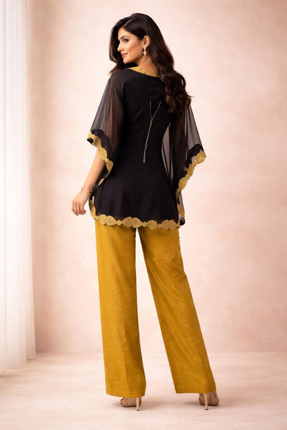 Black short organza cape with bool work & wired corset & self jaquard golden pant