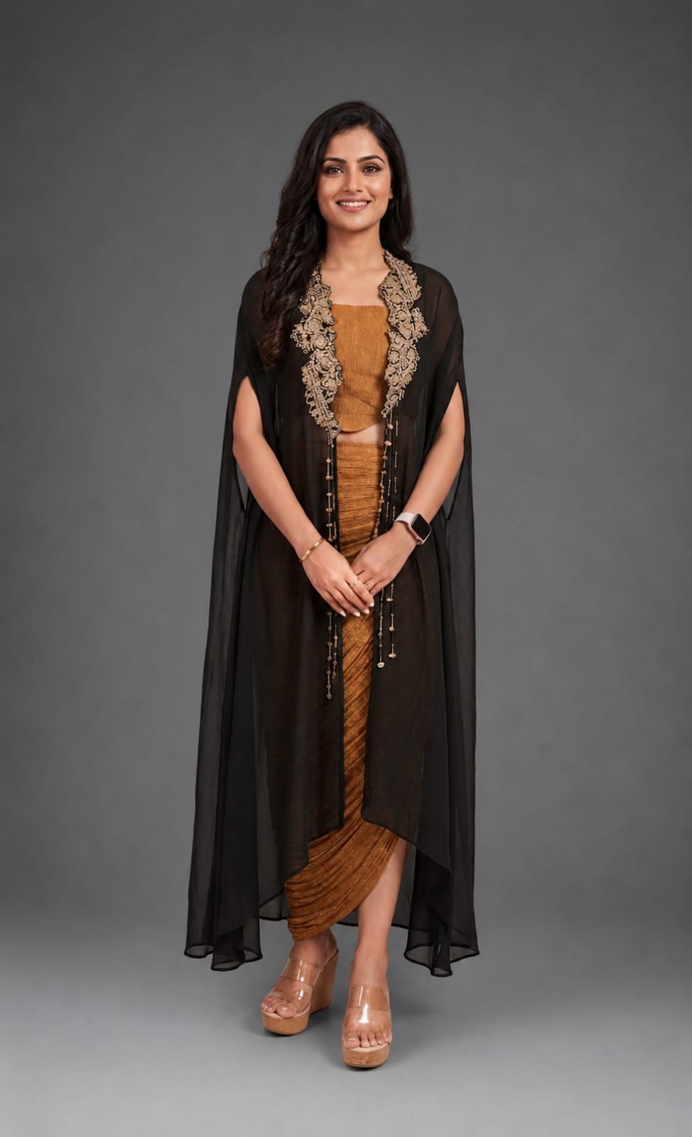 Black cape with crushed tissue skirt & bustier with long hangings on cape