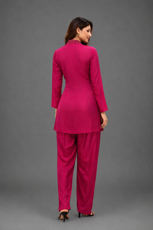 Hot pink cordset with hand work on neckline  of crystals