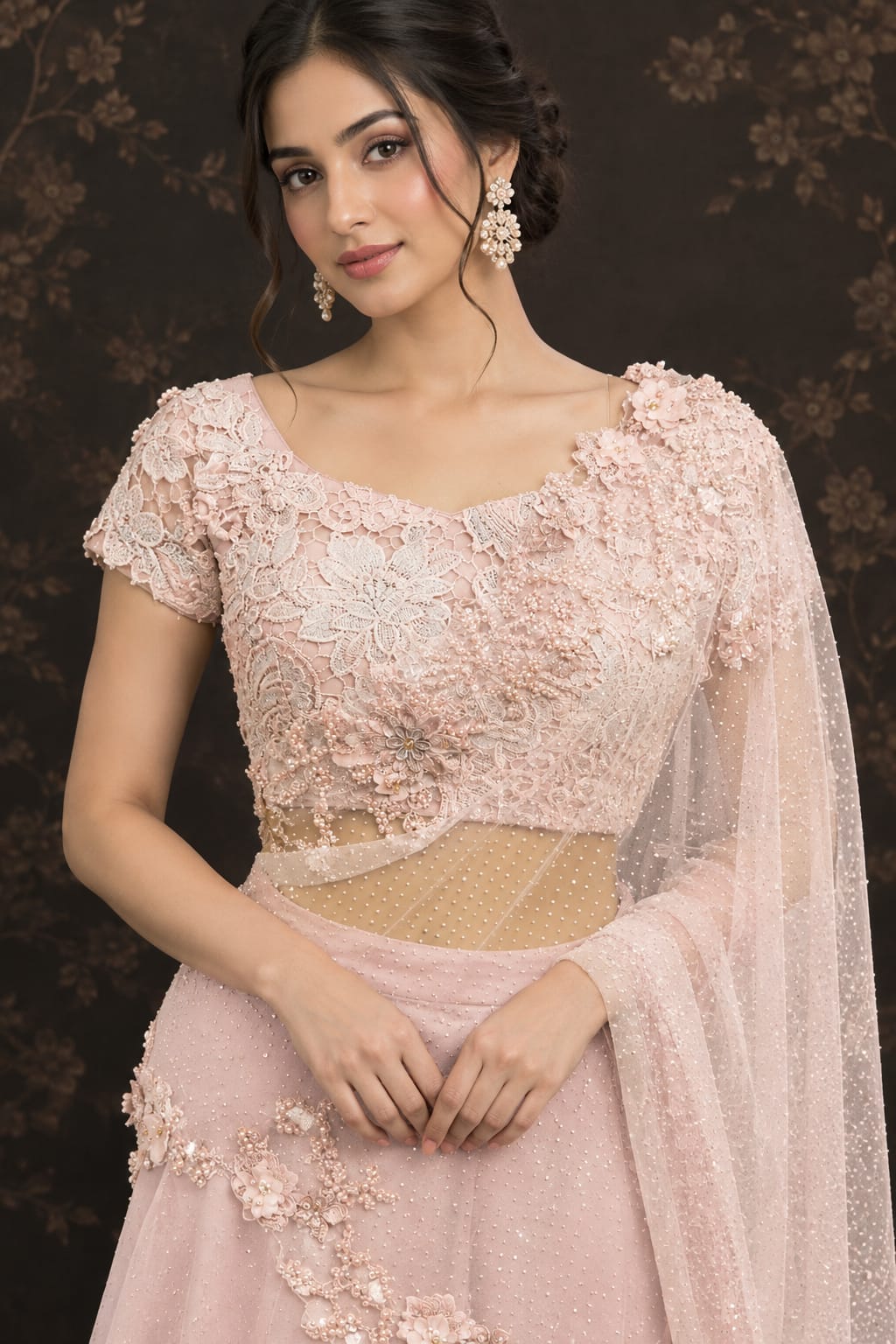 Soft pastel blush-pink lehenga in a delicate, flowy fabric with a subtle net.