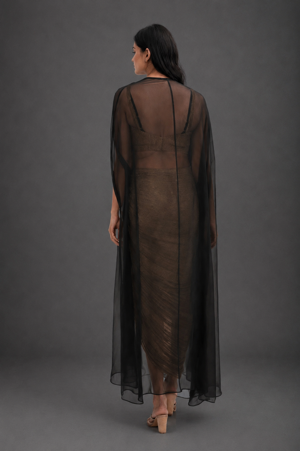 Black cape with crushed tissue skirt & bustier with long hangings on cape